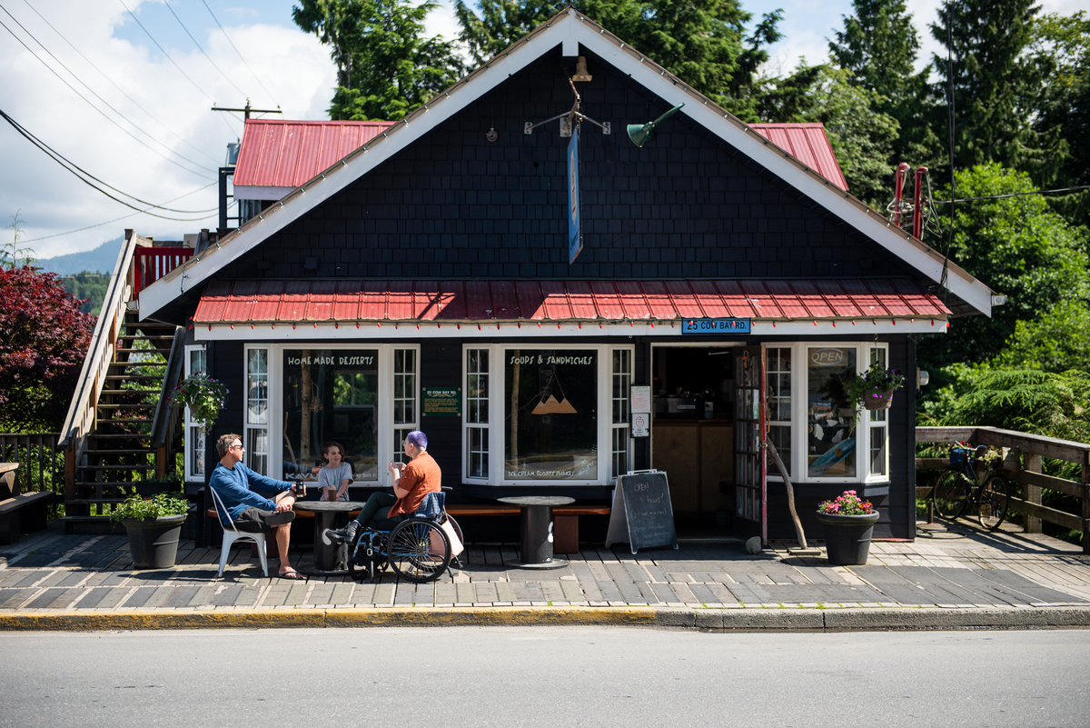 Friends sitting outside of Cowpuccino's Coffee House in Prince Rupert